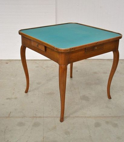 Rectangular game table in moulded walnut....
