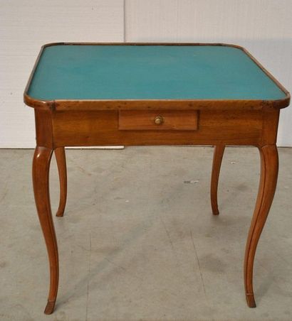 Rectangular game table in moulded walnut....