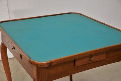 Rectangular game table in moulded walnut....
