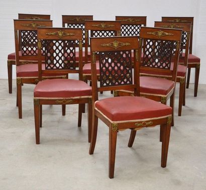 Dining room with ten chairs, a table, a sideboard...