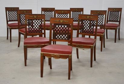 Dining room with ten chairs, a table, a sideboard...