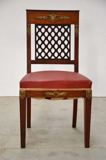 Dining room with ten chairs, a table, a sideboard...