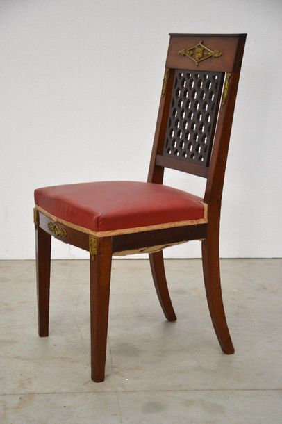 Dining room with ten chairs, a table, a sideboard...