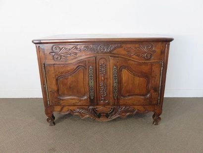 Moulded and carved walnut sideboard. Doors...