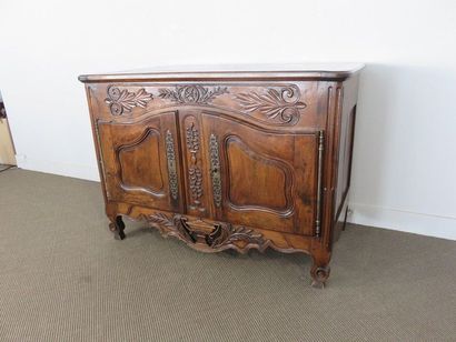 Moulded and carved walnut sideboard. Doors...