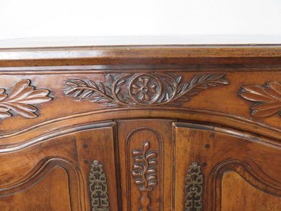 Moulded and carved walnut sideboard. Doors...