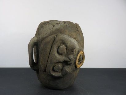DRUM. Wood with a crusty patina, carved in...
