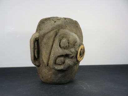 DRUM. Wood with a crusty patina, carved in...