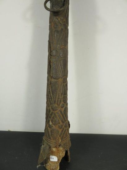 HORN. Wood and skin patinated by use, carved...