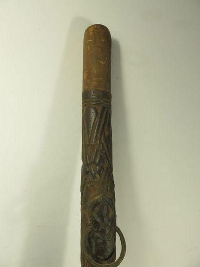 HORN. Wood and skin patinated by use, carved...