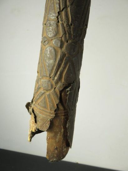HORN. Wood and skin patinated by use, carved...