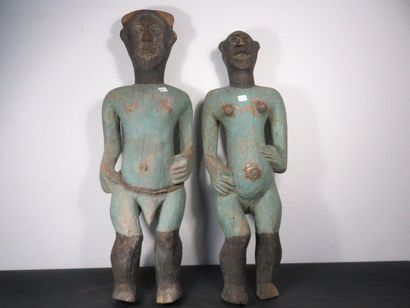 COUPLE OF STATUES. Wood painted green for...