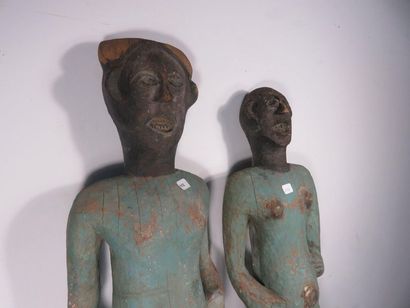 COUPLE OF STATUES. Wood painted green for...