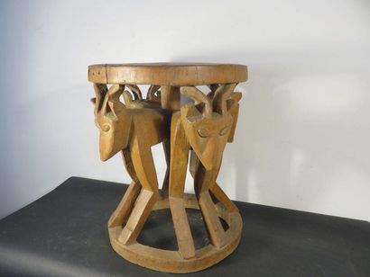 CHIEFTAIN'S STOOL. Wood carved with animal...