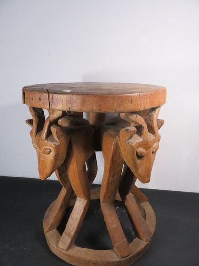 CHIEFTAIN'S STOOL. Wood carved with animal...