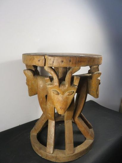 CHIEFTAIN'S STOOL. Wood carved with animal...