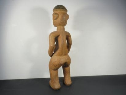 Female STATUS. Heavy wood. Missing the right...