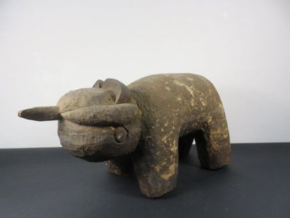 PHACOCHER? Wood with a crusty patina. Length...