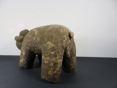 PHACOCHER? Wood with a crusty patina. Length...