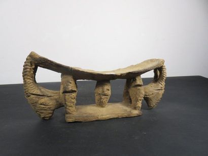 NECKREST carved with an animal at each end....