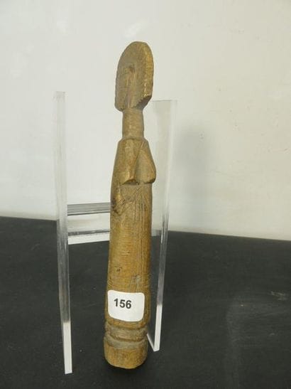 TWO DOLLS. Patinated wood, small engraved...