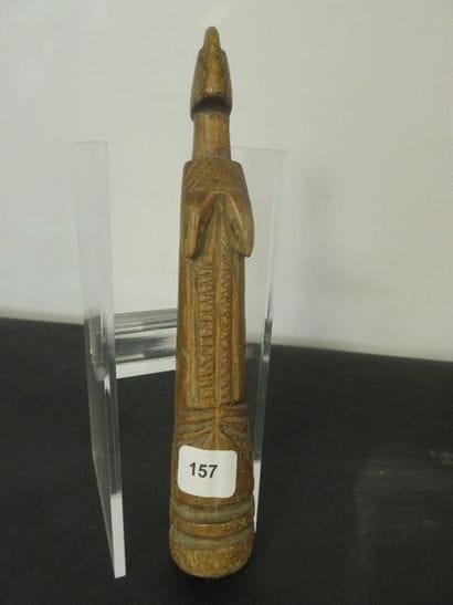 TWO DOLLS. Patinated wood, small engraved...