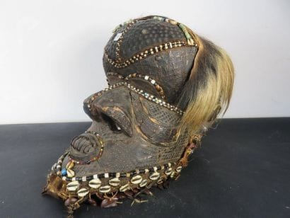 HELMET MASK. Wood, brass veneer, shells,...