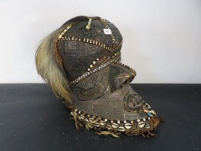 HELMET MASK. Wood, brass veneer, shells,...