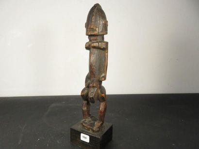Male fetish represented standing, arms glued...