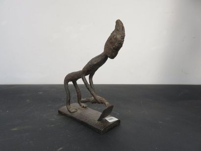 CHARACTER represented digging. Wrought iron....
