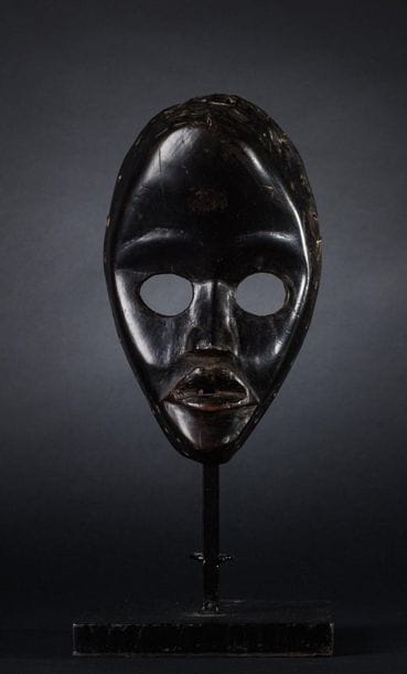 FACIAL MASK. Hard wood with black lacquered...