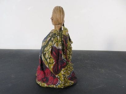 Female STATUS. Wood, light colour. Wears...