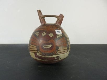 VASE. Spherical ceramic surmounted by two...