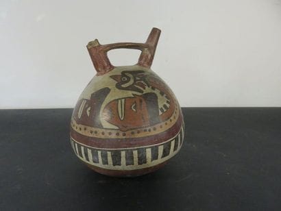 VASE. Spherical ceramic surmounted by two...