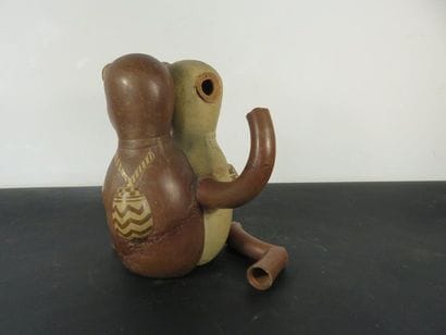 VASE representing a couple sitting side by...