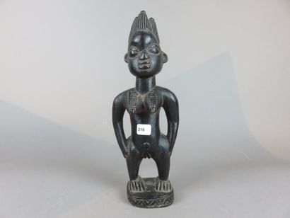 COUPLE de STATUETTES Ibedji. Bois, à belle...