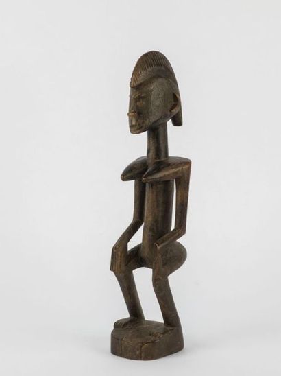 Feminine STATUETTE with bent legs, hands...