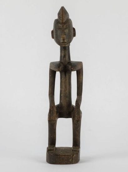 Feminine STATUETTE with bent legs, hands...