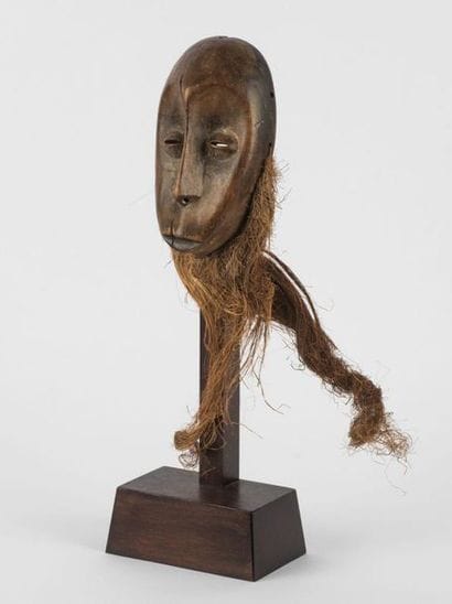 MASQUETTE. Wood with brown patina. Almond...