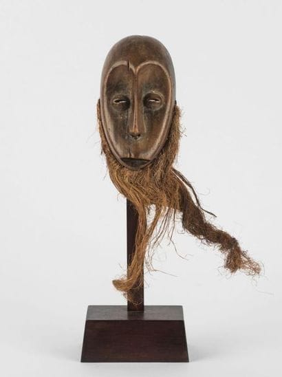 MASQUETTE. Wood with brown patina. Almond...