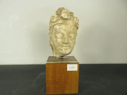 BODDISATVA'S HEAD. Stucco. Hair wrapped with...