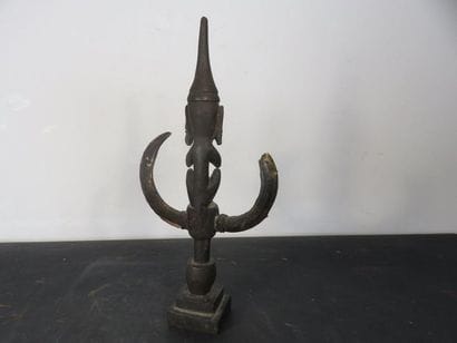 HANGER depicting a seated figure. Wood with...