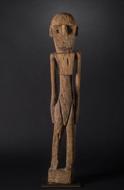 FEMALE ANCESTOR STATUE AITOS. Heavy eroded...