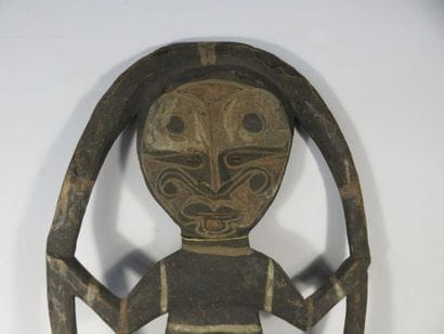 Wooden HANGER with a figure inscribed in...