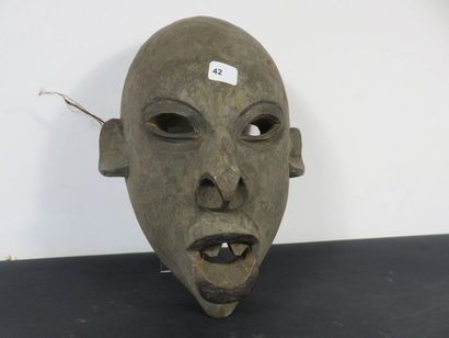 TWO MASKS Nigeria, one with a statuette on...