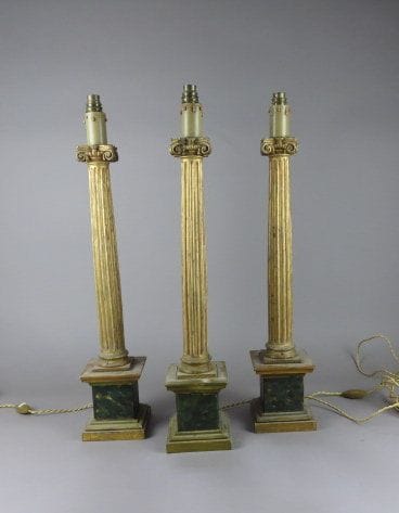 Suite de trois pieds de lampe en bois sculpté,...