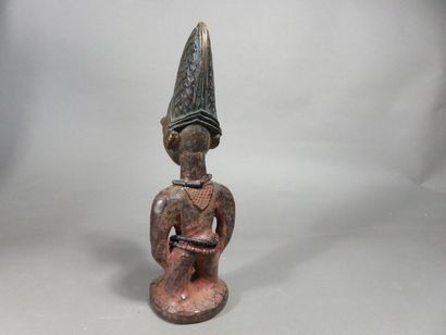 Ibedji. Statuette masculine. Le corps est...