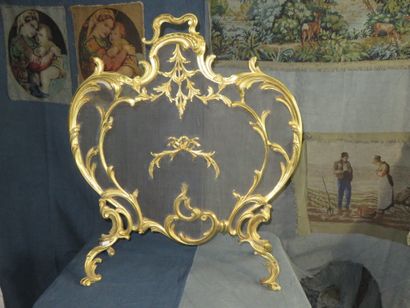 Pare-étincelle en bronze ciselé et doré à...