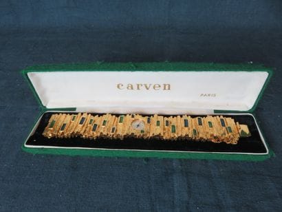 CARVEN 

Montre de dame en métal doré, signée....