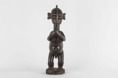 Male statue representing a B'mba (nimba)...